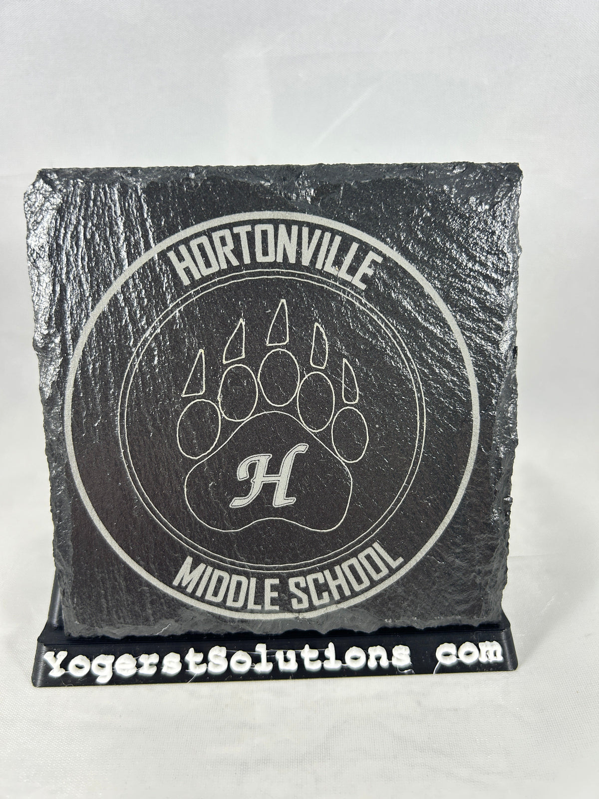 Hortonville Middle School claw logo engraved on slate with a Yogerst Solutions stand