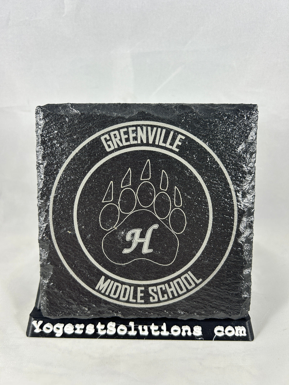 Greenville Middle School claw logo engraved on slate with a Yogerst Solutions stand