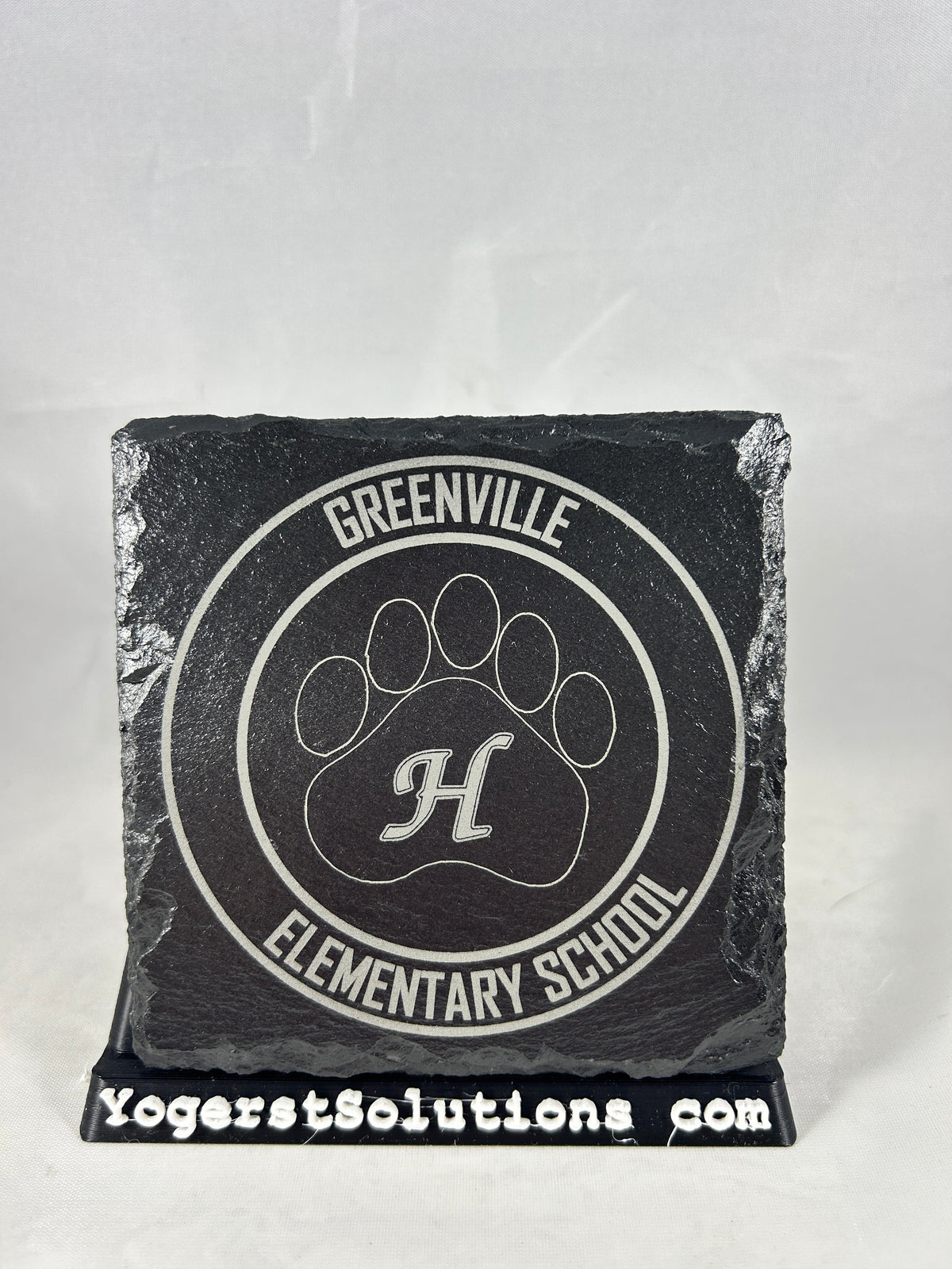 Greenville Elementary School paw logo engraved on slate with a Yogerst Solutions stand