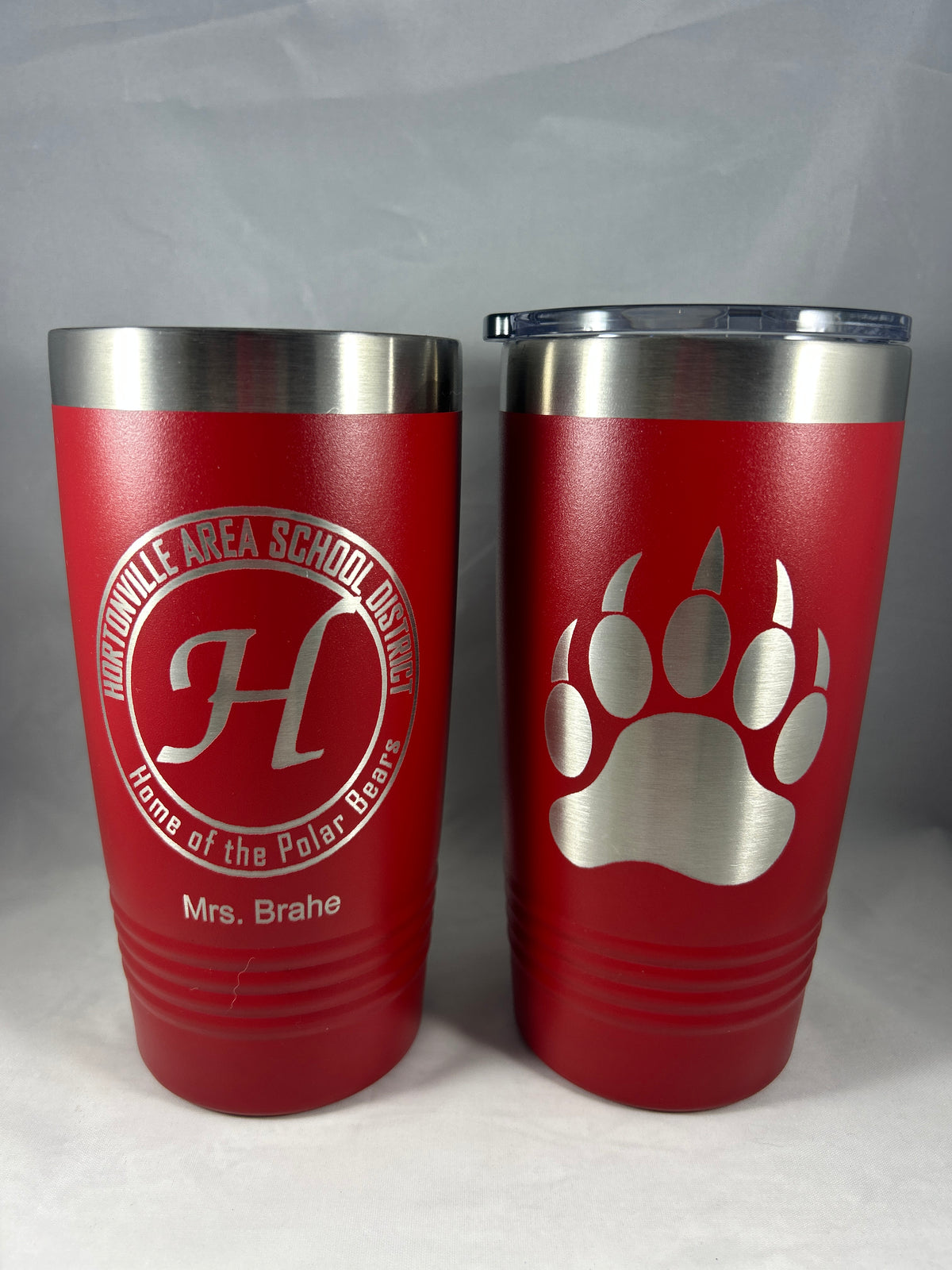 Red 20 oz Polar Camel tumbler engraved with two logos and the name Mrs. Brahe
